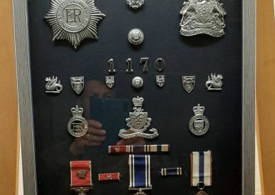 Framed policemans awards